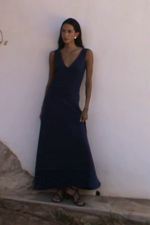 athena maxi dress navy A new summer favourite: The Athena Maxi Dress in navy blue. It drapes softly over the body to create a natural, effortless shape, while the clean V-neckline and streamlined finish lend an
